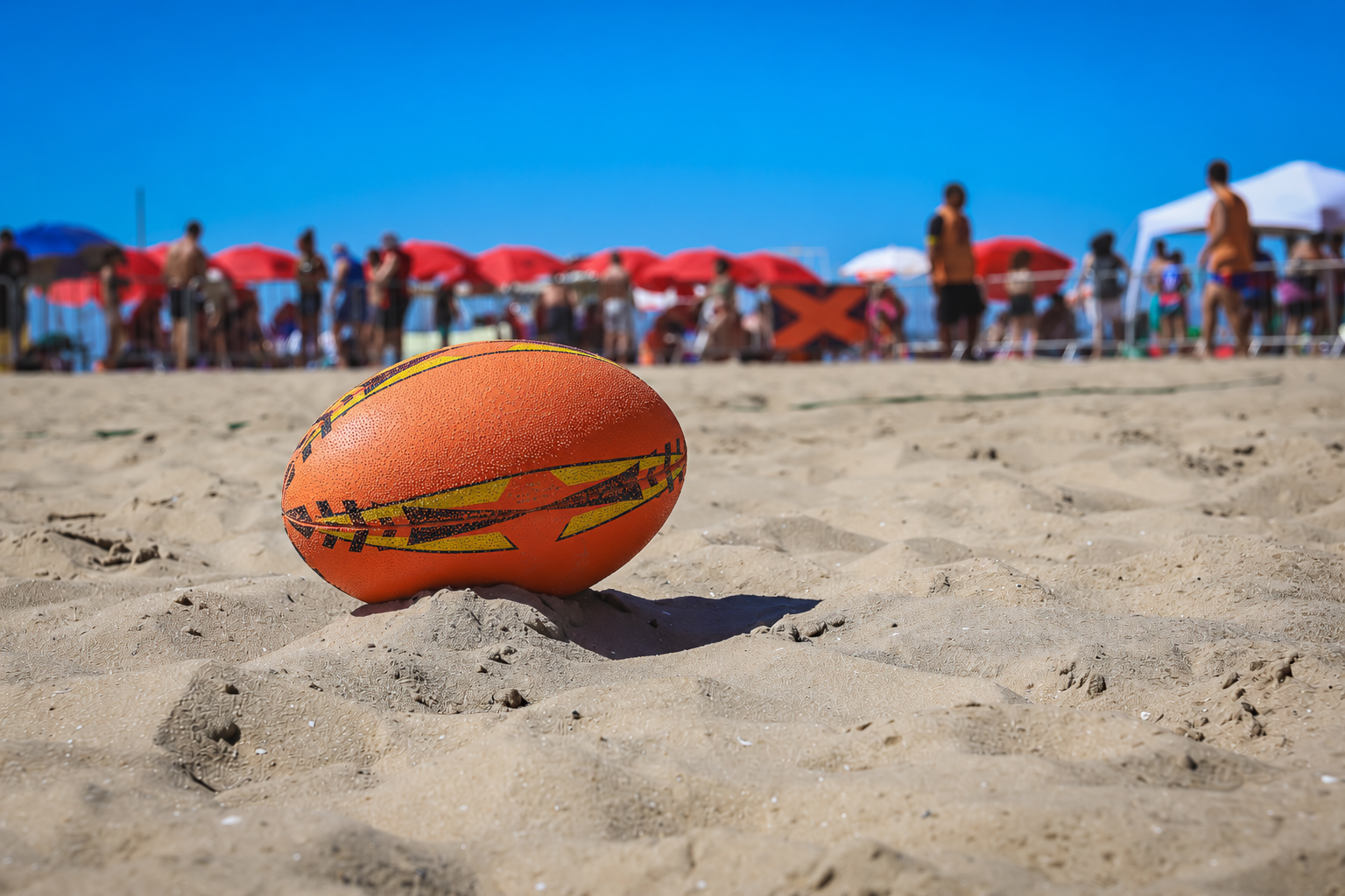 Bola de rugby na areia